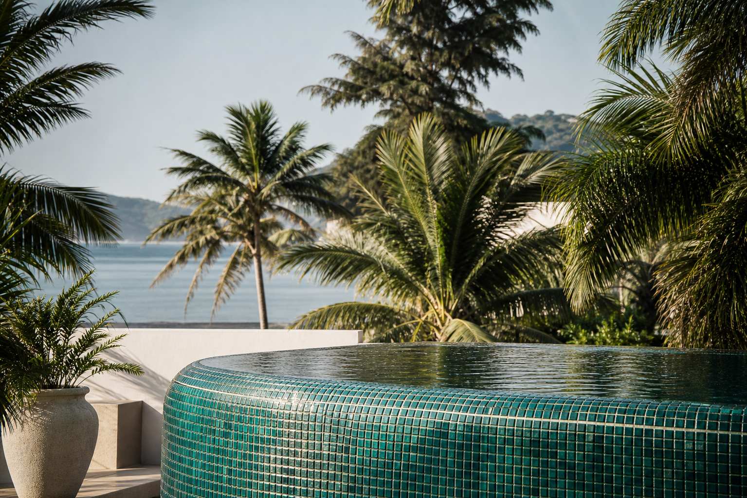 Matte porcelain pool tiles in soft gray installed along the waterline of a modern outdoor swimming pool.