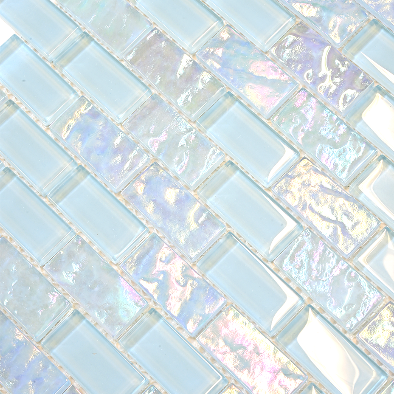 Macro close-up of Iridescent Ocean Blue glass mosaic showing pale pearlescent colour shift.