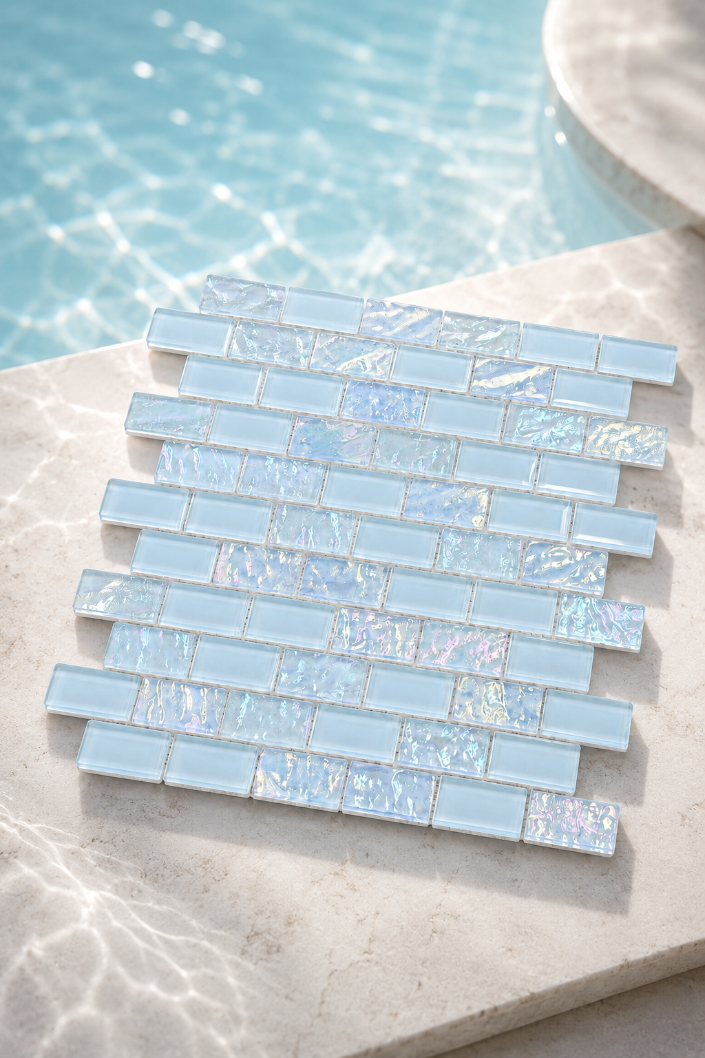 Iridescent blue glass mosaic tile lining a spa and water feature