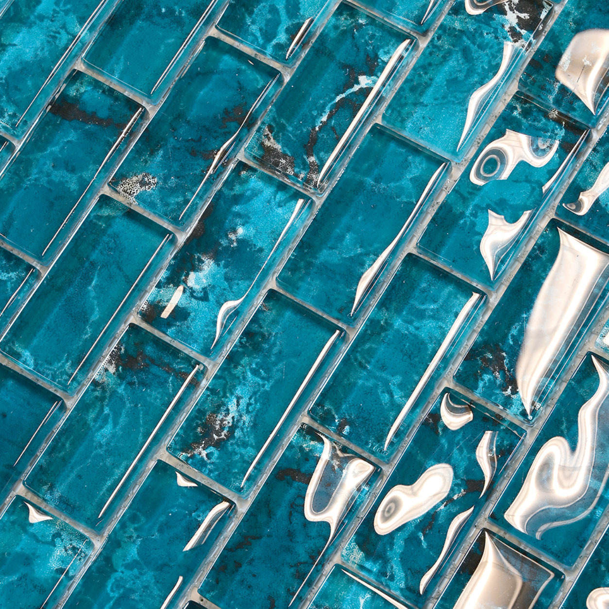 Macro close-up of Coastal Aqua Green glass mosaic showing glossy aqua and teal chips.