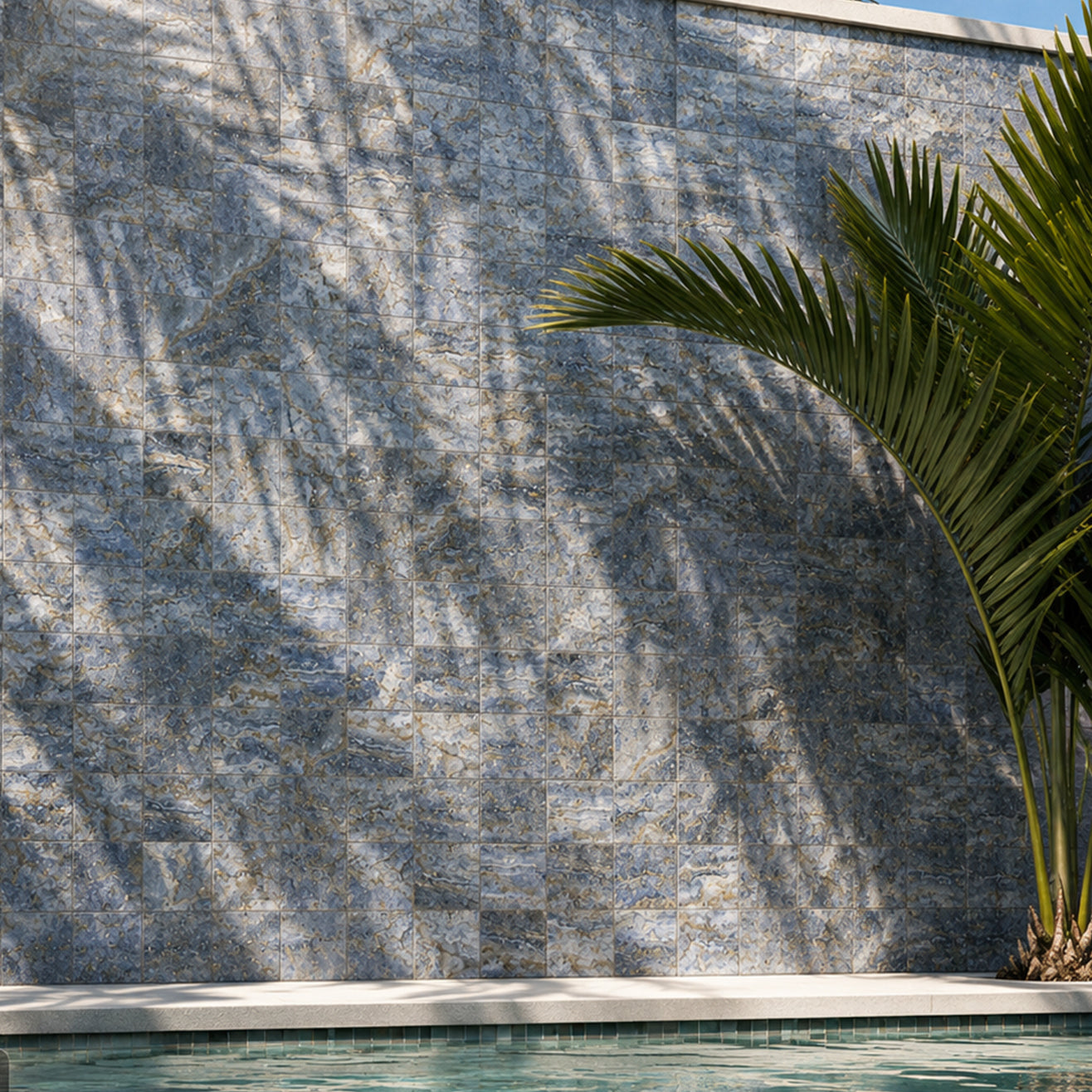6x6 blue porcelain tile on a raised pool wall with palm shadows and turquoise water