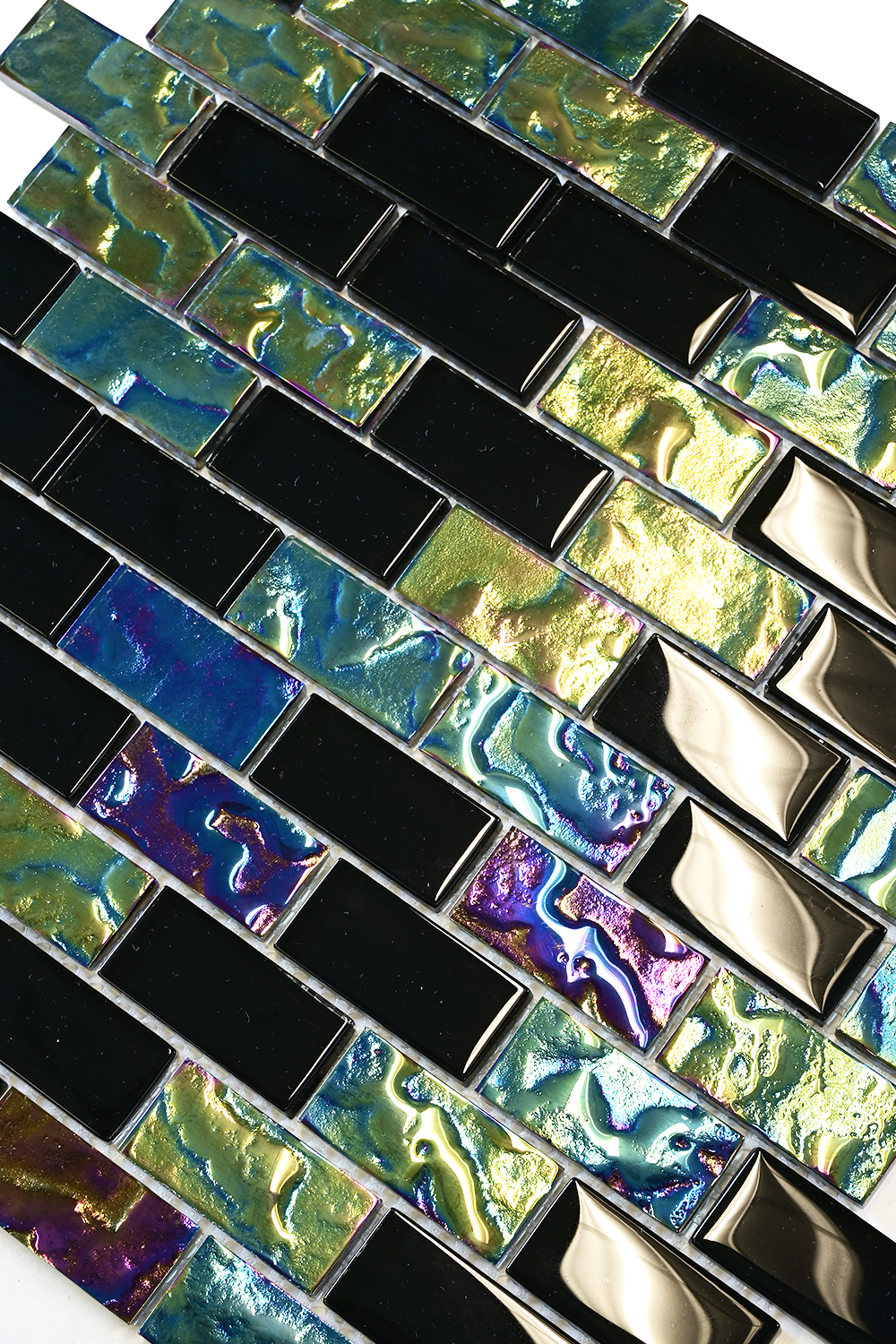 Close-up of Black Opal glass mosaic pool tile showing glossy black chips beside iridescent purple, green and blue chips.