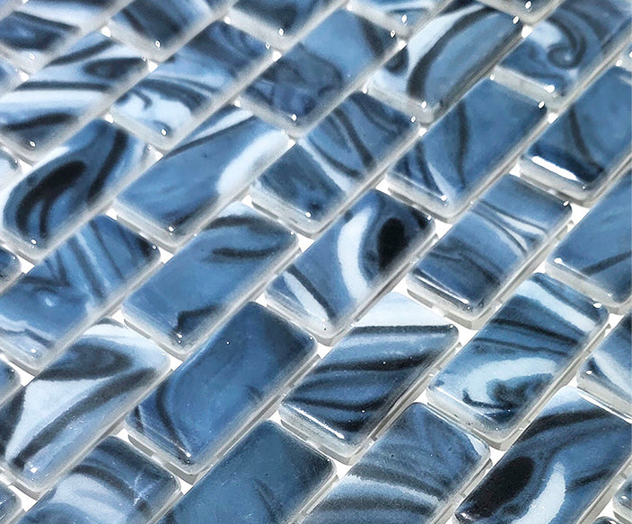Macro close-up of Storm Blue Marble recycled glass mosaic showing glossy blue and white swirled chips.